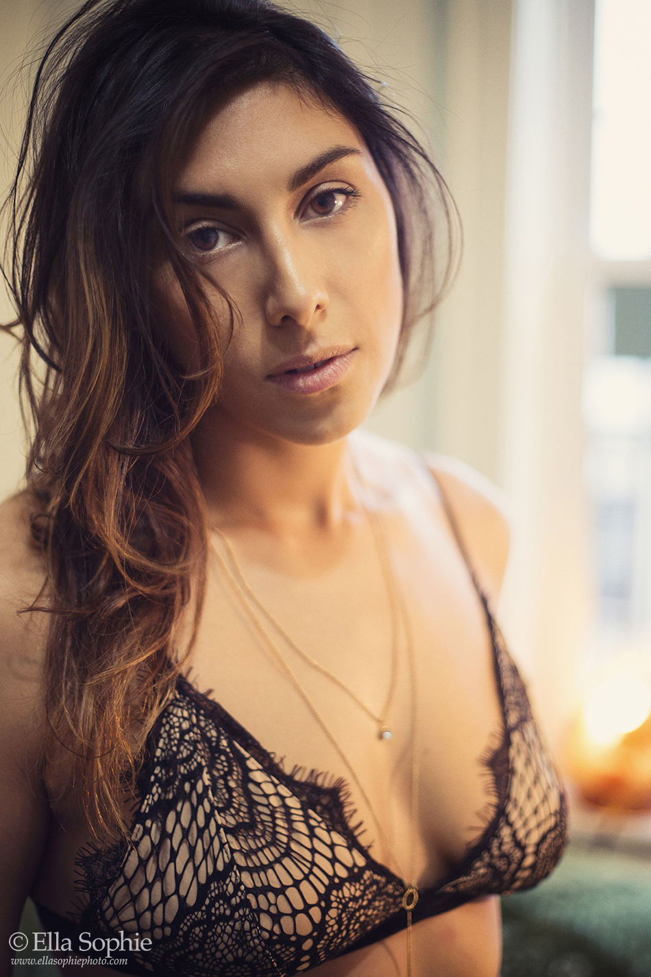 sexy tasteful boudoir portrait of brunette woman, brown eyes, wearing lace bra