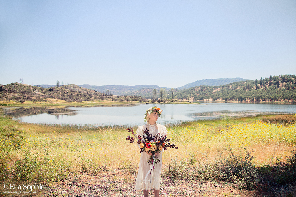 dry grass, burnt landscape, bride in vintage dress with flower crown and bouquet by Ella Sophie