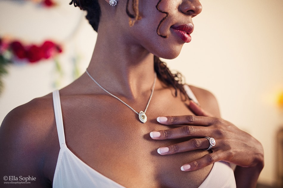 close up boudoir photo white gold necklace ethical jewelry 