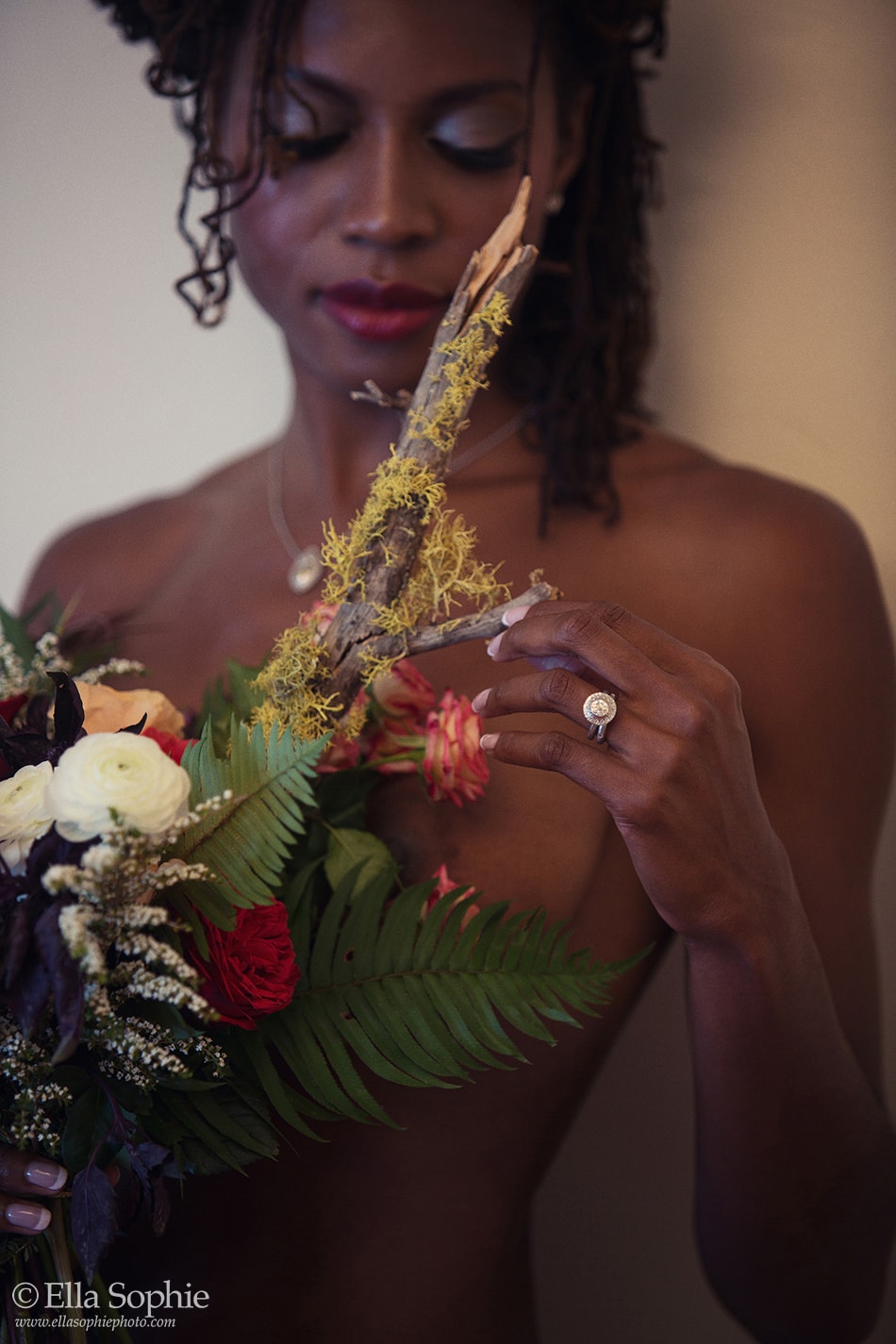 close up boudoir with wild flower bouquet and diamond ring