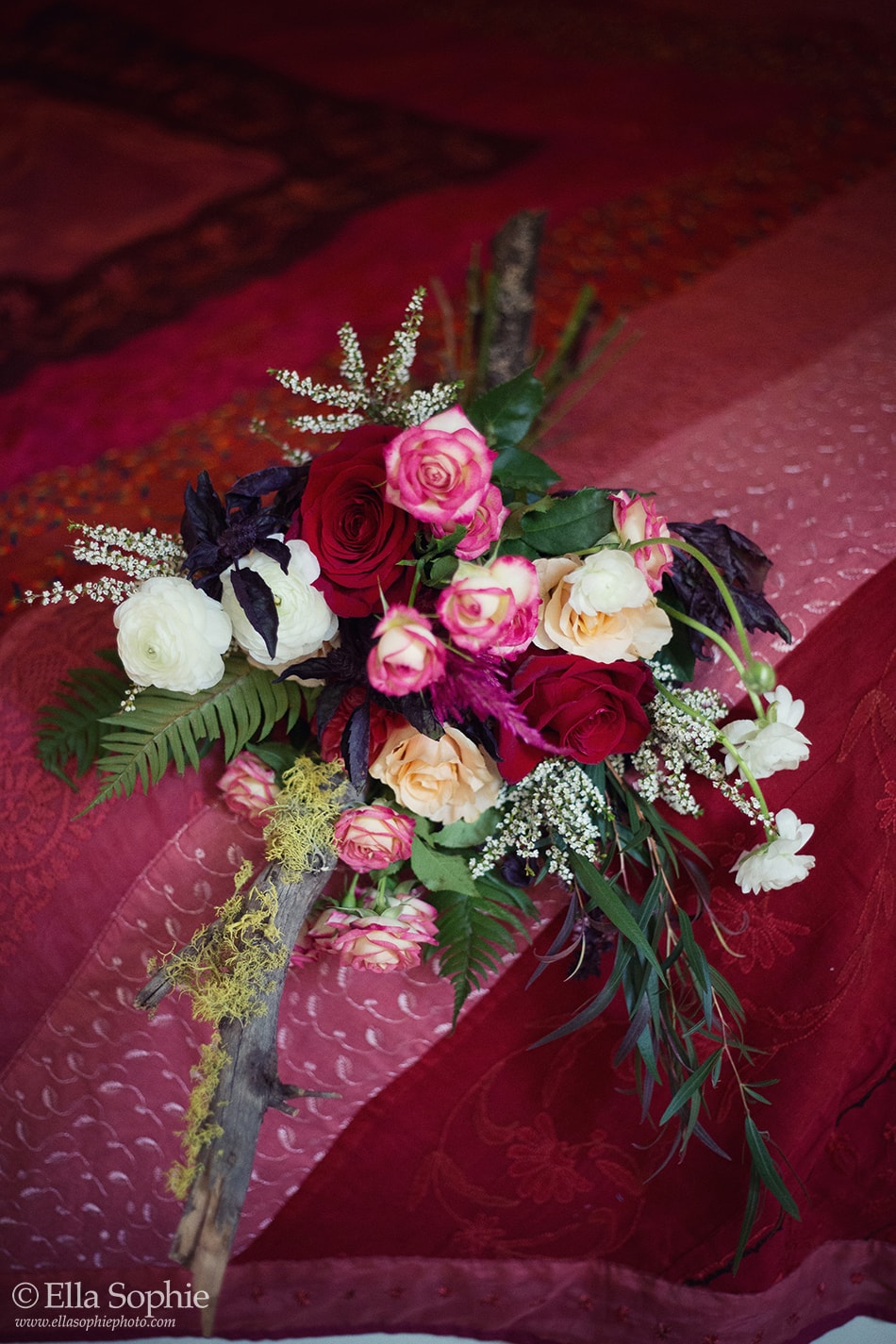 red flower bouquet with moss and sticks. creative bouquet idea