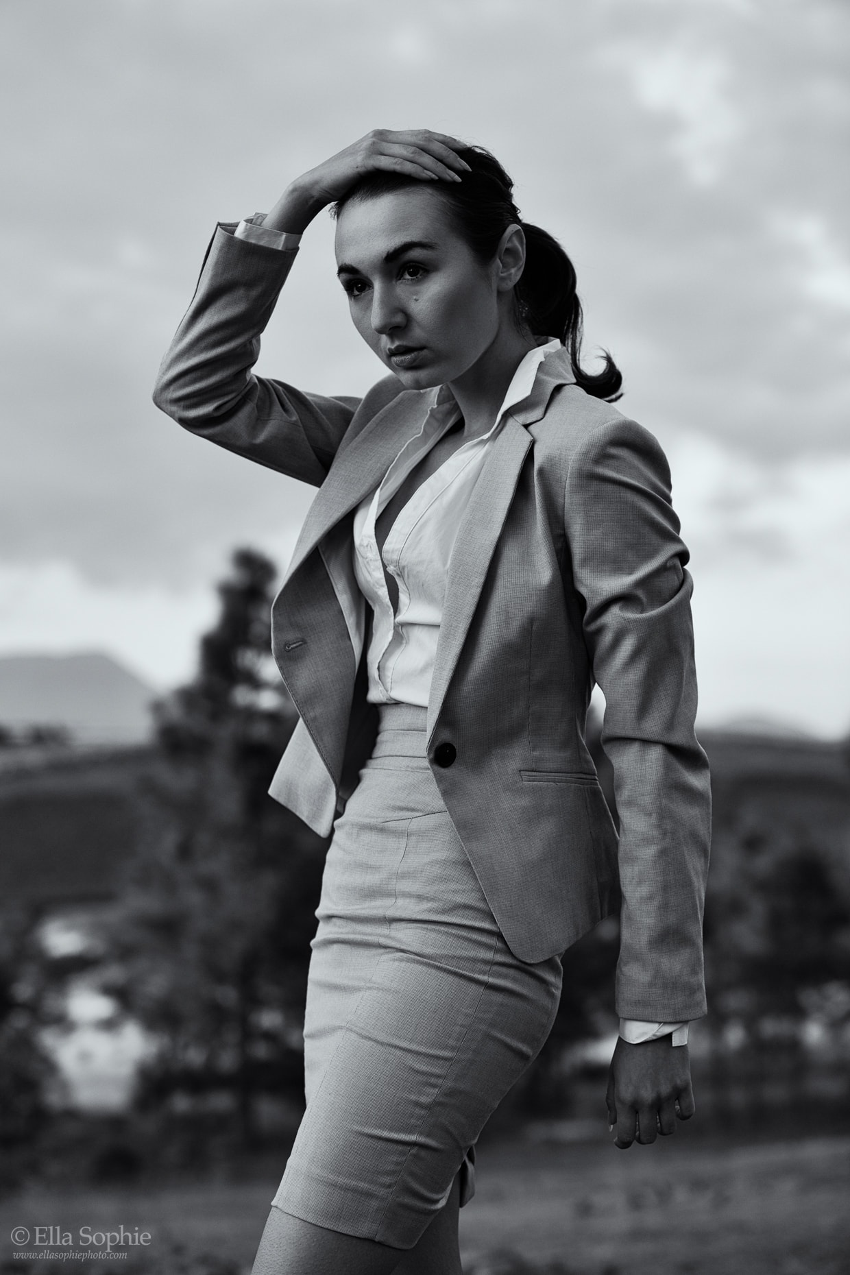 Model Zoe West in a skirt suit, black and white. Photo by Ella Sophie