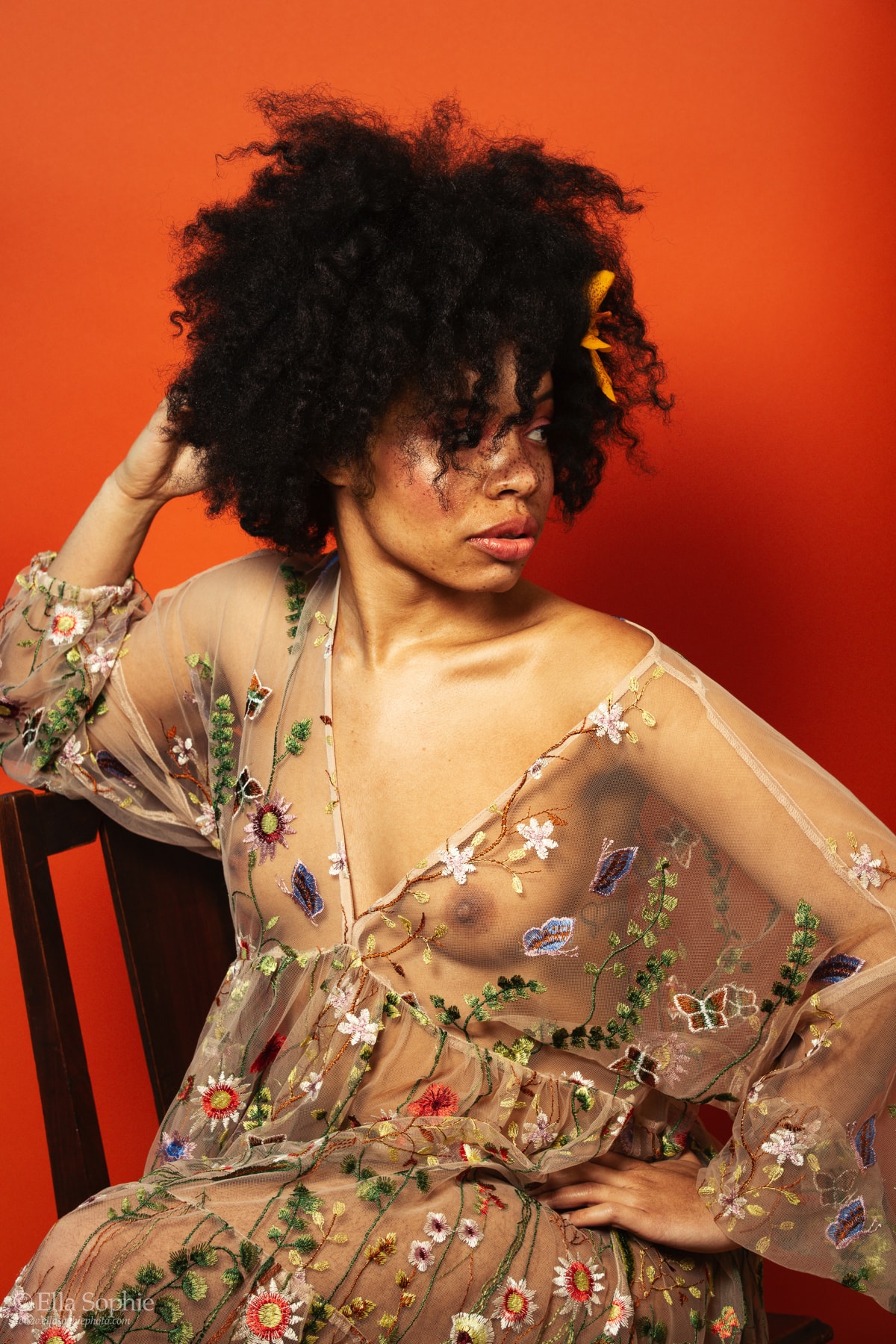 Empowering boudoir, risque portraits of natural beauty with freckles, afro hair, floral dress