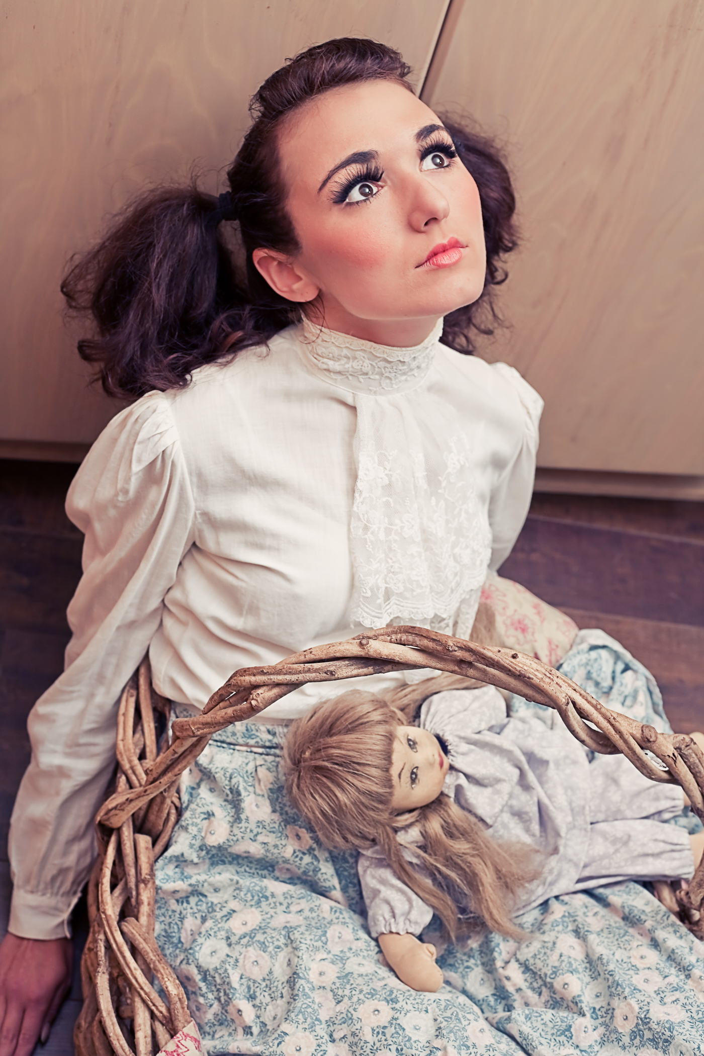 Zoe West posing as creepy doll in art series by Ella Sophie