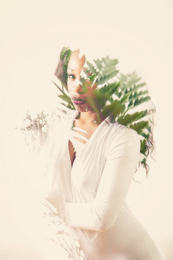Obscured Light Series, experimental portrait photography by Ella Sophie, woman in white with ferns. 
