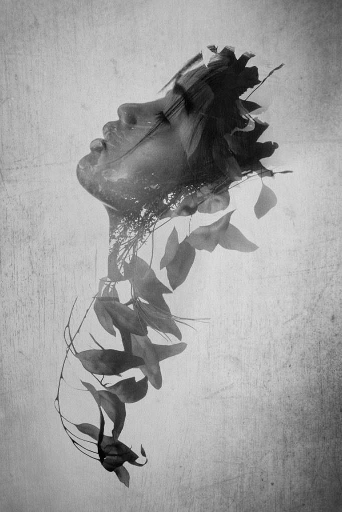 Obscured Light portrait of Chelsea Sanson. Black and white multiple exposure woman with leaves and wood texture by Oakland photographers Ella Sophie