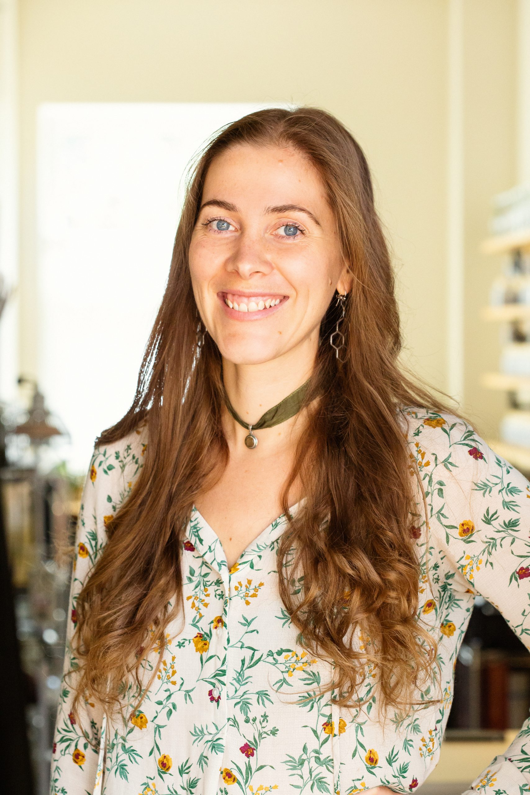 Smiling healthcare professional Dr. Clara Wetmore in lifestyle branding photoshoot by California photographer Ella Sophie. On location photography session in clinic.