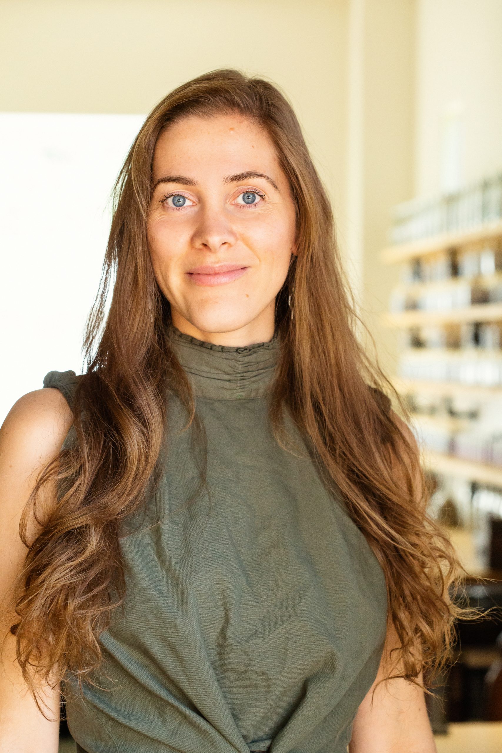 Professional portrait photographer Ella Sophie captures Dr. Clara Wetmore in her Taos NM acupuncture clinic. Warm inviting portrait for a health care professional. 