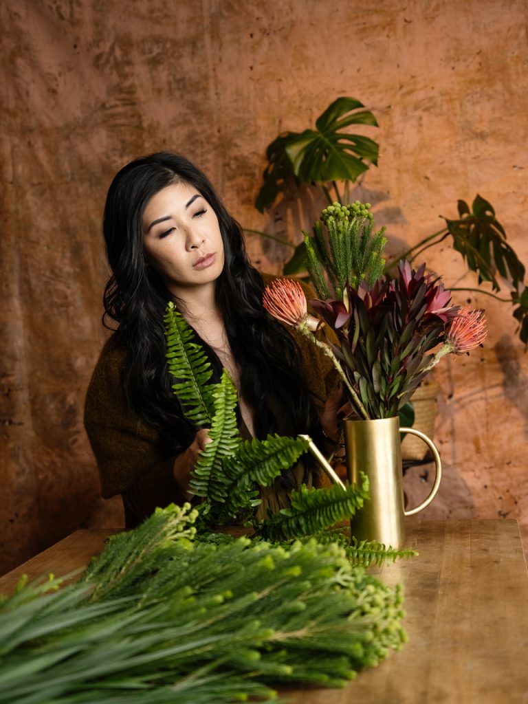 Branding portraits of floral designer working in her studio. 