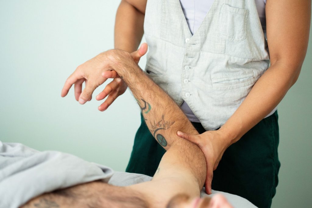 Client interaction detail photo for massage studio by Oakland wellness brand photographer Ella Sophie. 